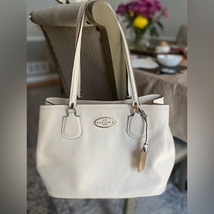 COACH handbag in off white color